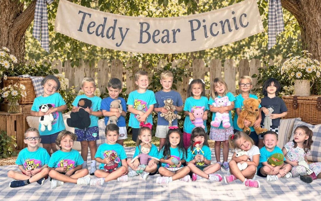 Preschool class holding stuffed animals at a Teddy Bear Picnic at First Friends Preschool in Prosper